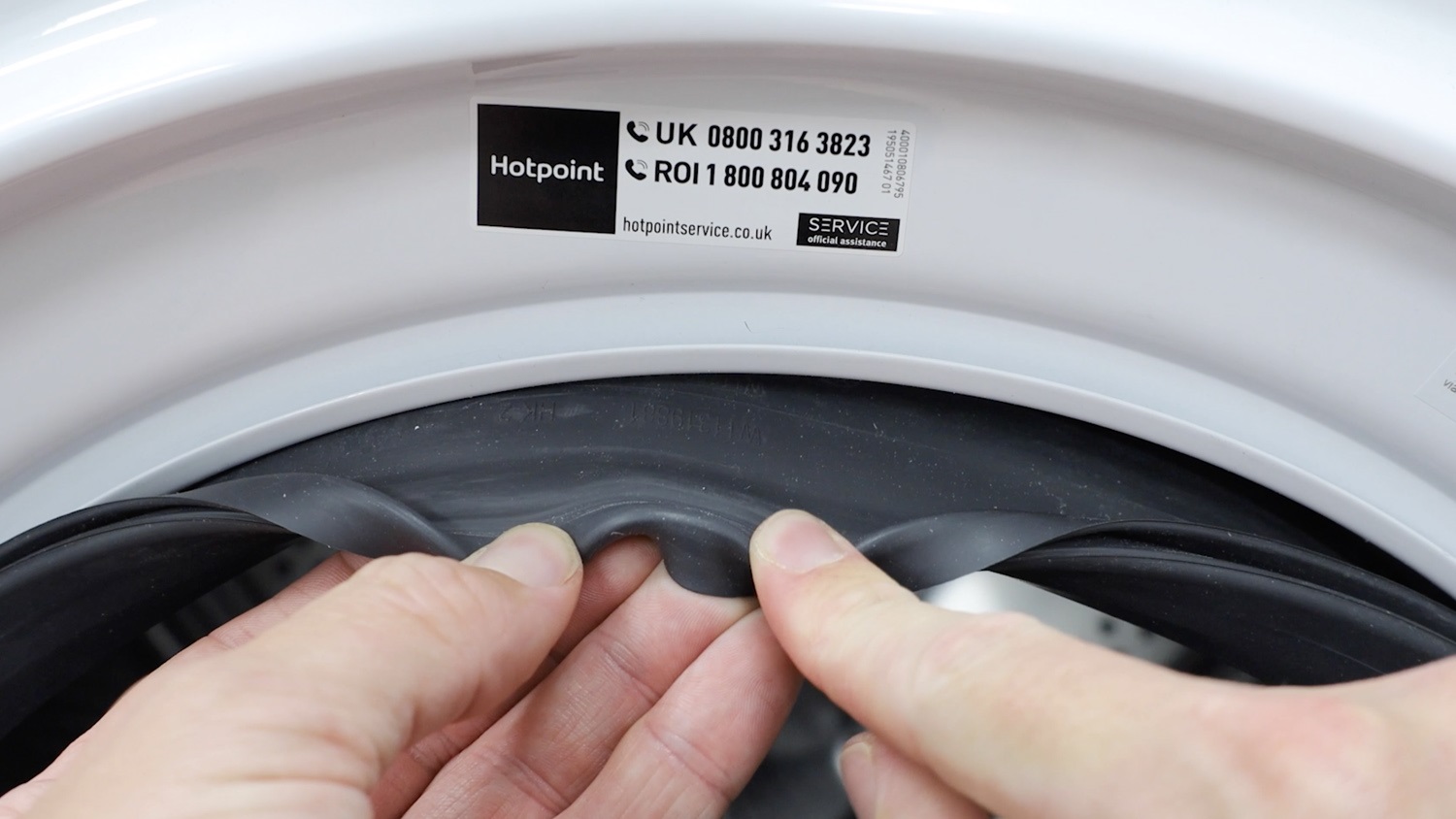 Attach front of door seal to washing machine